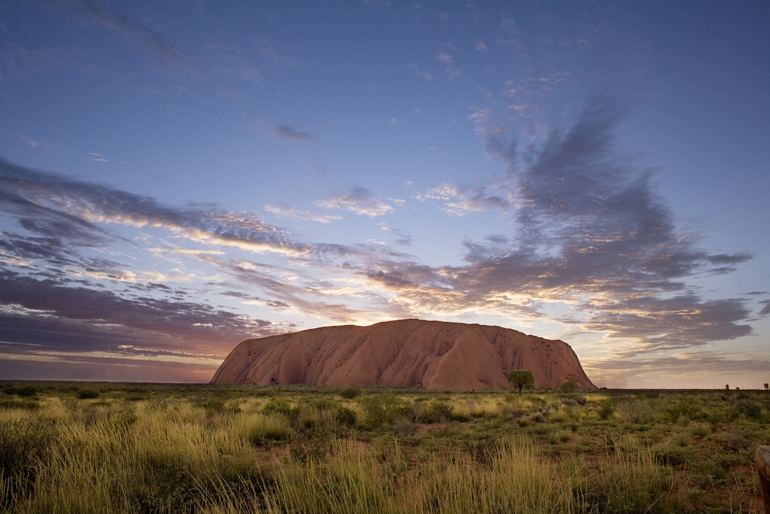 Experience bush luxury and outback experiences in Australia at Uluru at dusk