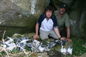 Rob Pennicott with dead sea-birds on Tasman Island